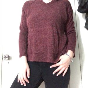 A large burgundy long sleeve top
